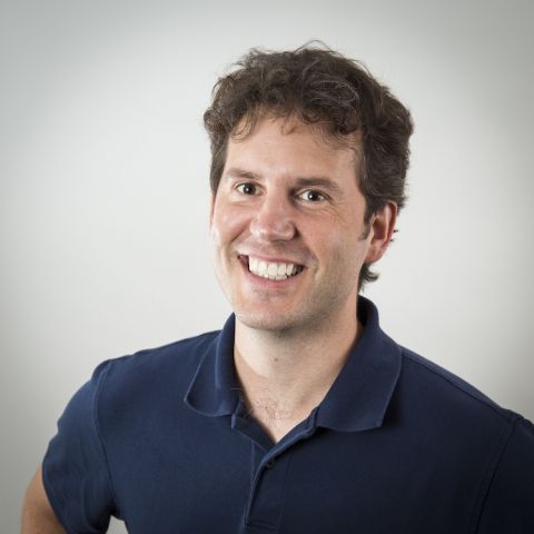 Man in navy blue polo.